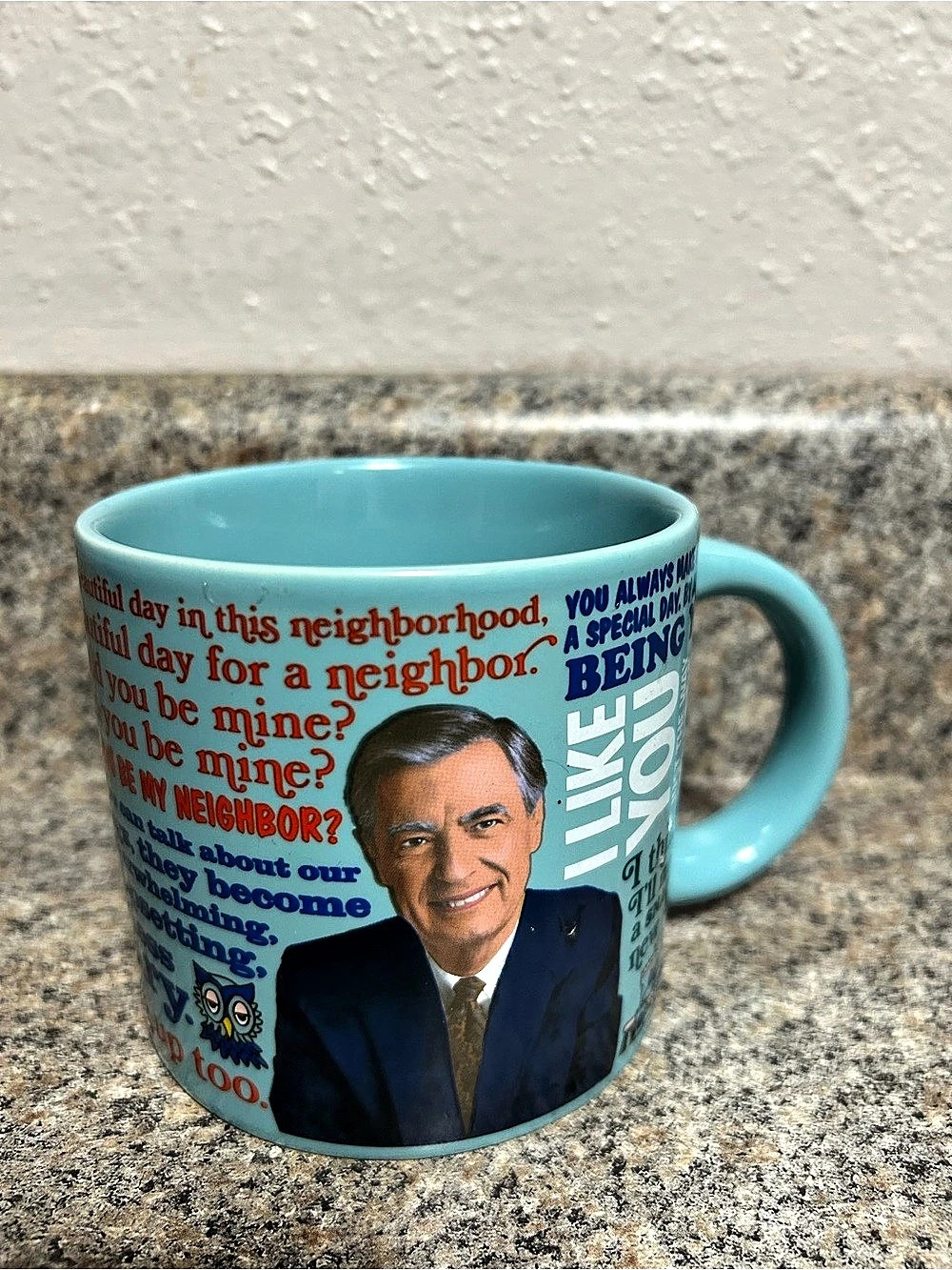 Mister Rogers Heat Activated Mug. Add hot liquid, Navy Jacket changes to a Tan S